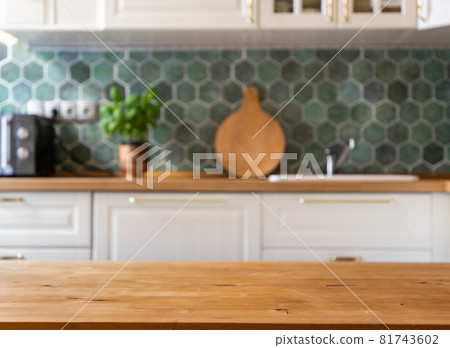 blurred kitchen interior and wooden desk space home background blurred kitchen interior and wooden desk space home background 81743602