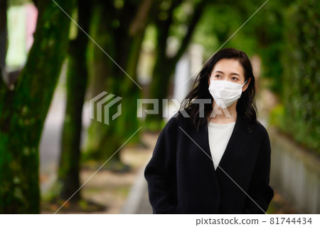 A woman in a coat A woman in a coat 81744434