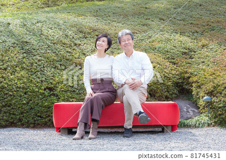 Senior couple trip A good couple sitting on a chaise longue and talking about memories 81745431