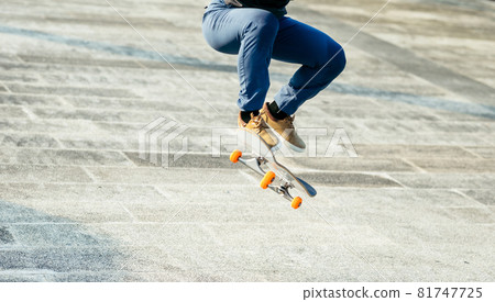 Skateboarder skateboarding outdoors in city 81747725