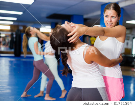 Woman training eye-gouging movement 81751594