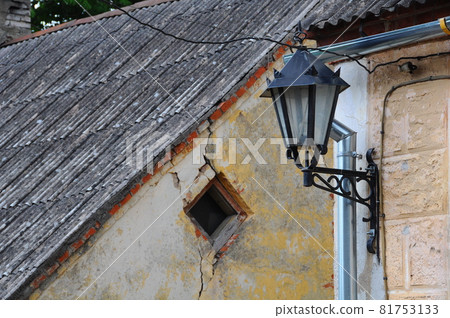 Classic metal lantern on grunge wall background Classic metal lantern on grunge wall background 81753133