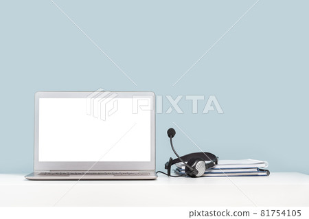 Laptop with headphones on white desk banner Laptop with headphones on white desk banner 81754105