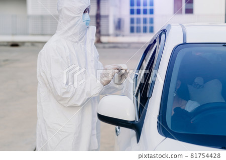 Medical worker in protective suit screening woman Driver to Sampling secretion to check for Covid-19. . Medical worker in protective suit screening woman Driver to Sampling secretion to check for Covid-19. . 81754428