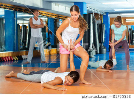 Young lady doing wristlock Young lady doing wristlock 81755538