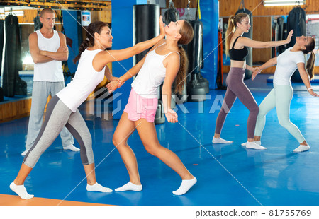 Asian woman doing heel palm chin strike 81755769