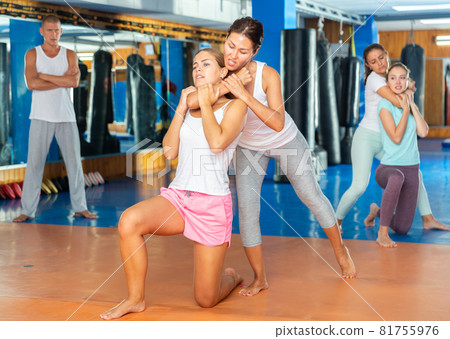 Woman doing chokehold movement 81755976