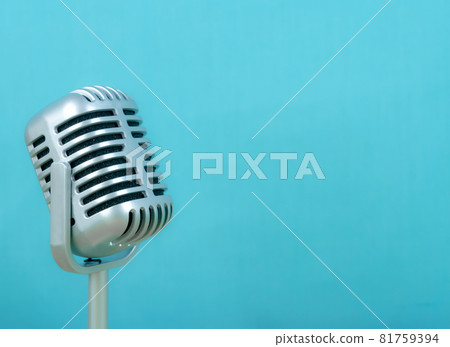 Retro microphone on blue background Retro microphone on blue background 81759394