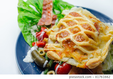 Chicken en croute, chicken breast inner fillets with mature cheddar cheese and beechwood smoked streaky bacon in a puff pastry lattice 81761662