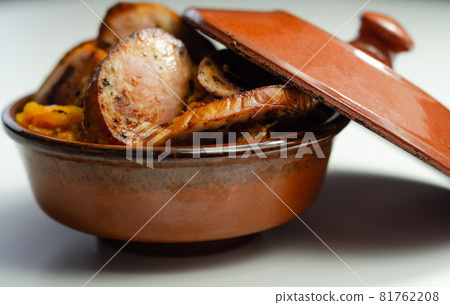 Traditional Polish dish called bigos made of sauerkraut, sausage and mushrooms, food served warm in a ceramic bowl Traditional Polish dish called bigos made of sauerkraut, sausage and mushrooms, food served warm in a ceramic bowl 81762208