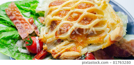 Chicken en croute, chicken breast inner fillets with mature cheddar cheese and beechwood smoked streaky bacon in a puff pastry lattice 81763280