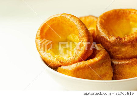 Traditional English Yorkshire pudding, wonderfully crisp and golden baked for a traditional recipe, accompaniment for the perfect Sunday roast 81763619