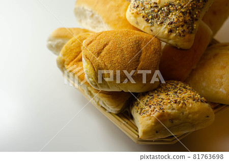 Various types of bread served on a wicker tray, delicious and fresh rolls Various types of bread served on a wicker tray, delicious and fresh rolls 81763698