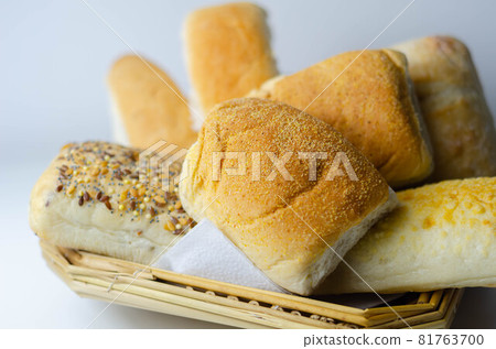 Various types of bread served on a wicker tray, delicious and fresh rolls Various types of bread served on a wicker tray, delicious and fresh rolls 81763700