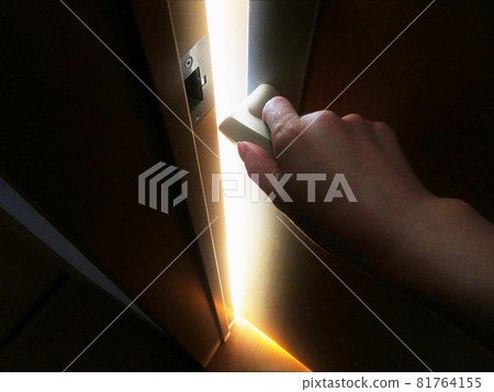 Open the door and there is light. Coming out of the darkness. Hand opening the door. Image of a way out. 81764155