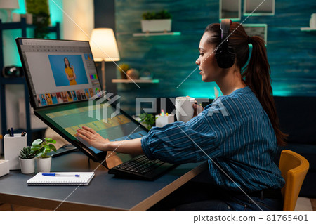Graphic software editor with headphones working 81765401