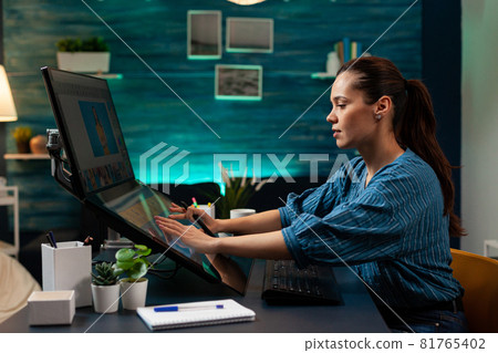 Photography designer working on image with stylus Photography designer working on image with stylus 81765402