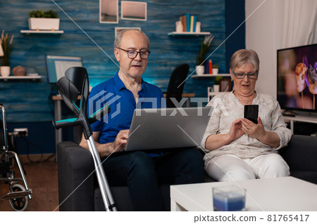 Senior family using modern technology devices 81765417