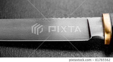 Handmade beautiful hunting knife with a sharp gray blade Handmade beautiful hunting knife with a sharp gray blade 81765562