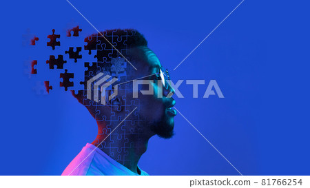 Profile, side view of young man's head made of flying pieces of puzzle, modern art collage. Concept of diversity, mental health, emotion, inner world, creativity 81766254