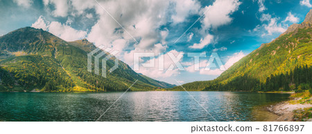 Tatra National Park, Poland. Famous Mountains Lake Morskie Oko Or Sea Eye Lake In Summer Morning. Beautiful Sunrise Sunrays Above Tatras Lake Landscape Tatra National Park, Poland. Famous Mountains Lake Morskie Oko Or Sea Eye Lake In Summer Morning. Beautiful Sunrise Sunrays Above Tatras Lake Landscape 81766897