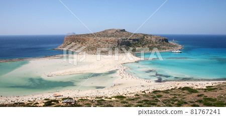 Balos lagoon with turquoise clear water with beautiful white sand beaches and Gramvousa island on Crete in Greece Balos lagoon with turquoise clear water with beautiful white sand beaches and Gramvousa island on Crete in Greece 81767241