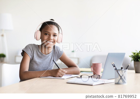 Afro american kid studying using computer, preschool child at home school Afro american kid studying using computer, preschool child at home school 81769952