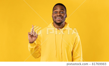African American Guy Pointing Finger Up Having Inspiration, Yellow Background 81769983