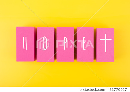 Modern religious minimal concept of hope with christian cross on bright yellow background 81770927