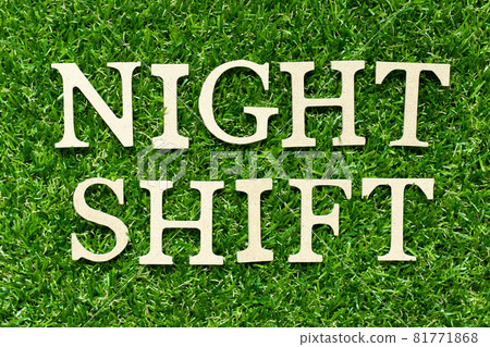 Wood letter in word night shift on green grass background Wood letter in word night shift on green grass background 81771868
