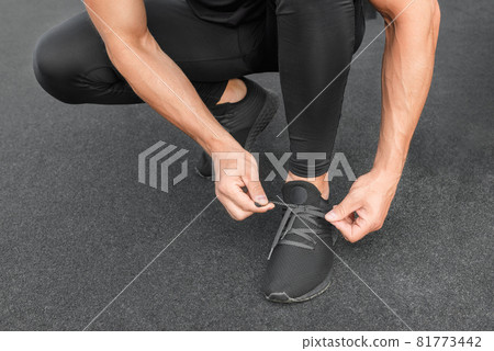 Young male jogger athlete training and doing workout outdoors in city. Young male jogger athlete training and doing workout outdoors in city. 81773442