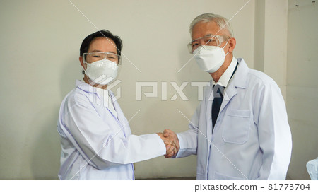 Asian senior doctors researchers hand shake cooperate in team to find solutions health care Asian senior doctors researchers hand shake cooperate in team to find solutions health care 81773704