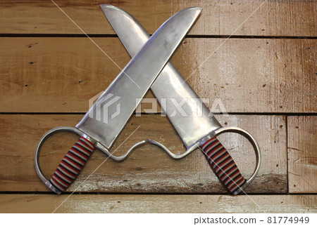 Wing Chun Butterfly Swords on Wall, Shallow DOF 81774949