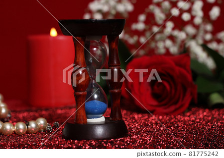 Red Candle and Rose on Red Velvet Background 81775242