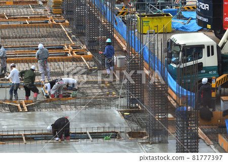 Newly constructed apartment building - concrete pouring work 81777397
