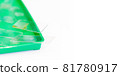 Microscopy and used laboratory glasses for the microscope are on a green tray after the study 81780917