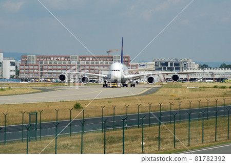 FRANKFURT, GERMANY - JUN 09th, 2017: Airbus A380 of Lufthansa with registration D-AIMH moves on taxiway by tow truck before departure from FRA airport FRANKFURT, GERMANY - JUN 09th, 2017: Airbus A380 of Lufthansa with registration D-AIMH moves on taxiway by tow truck before departure from FRA airport 81782392