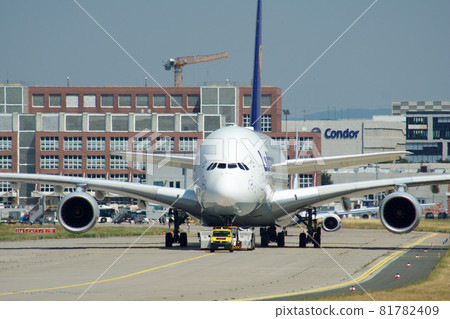 FRANKFURT, GERMANY - JUN 09th, 2017: Airbus A380 of Lufthansa with registration D-AIMH moves on taxiway by tow truck before departure from FRA airport 81782409