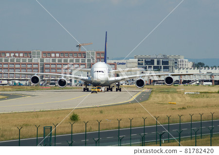 FRANKFURT, GERMANY - JUN 09th, 2017: Airbus A380 of Lufthansa with registration D-AIMH moves on taxiway by tow truck before departure from FRA airport 81782420