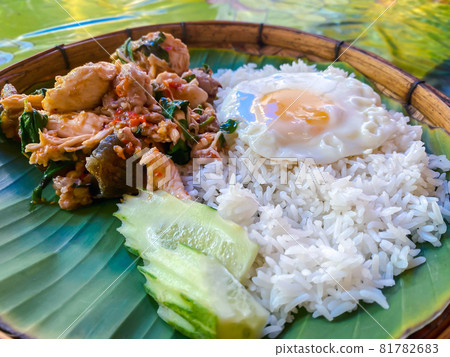 Rice topped with stir-fried pork or beef and basil Rice topped with stir-fried pork or beef and basil 81782683
