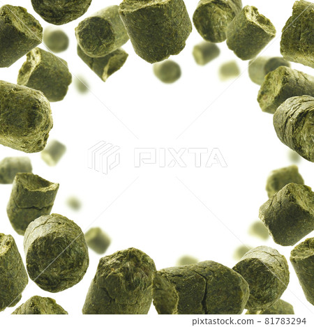 Green granulated hops levitate on a white background Green granulated hops levitate on a white background 81783294