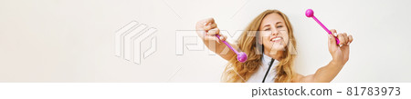 Young woman fooling with femine sex toys. Kegel adult exercise. 81783973