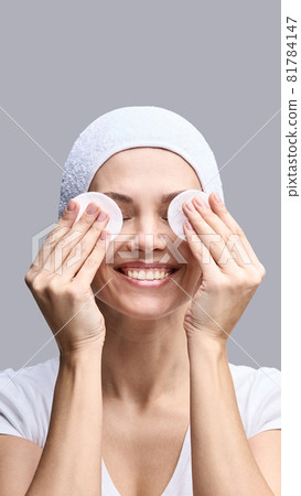 Cosmetology face cleaning. Female portrait. White cotton pad 81784147