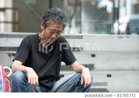 Street life tired homeless sitting Street life tired homeless sitting 81785772