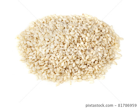 handful of white sesame seeds closeup on white background 81786959