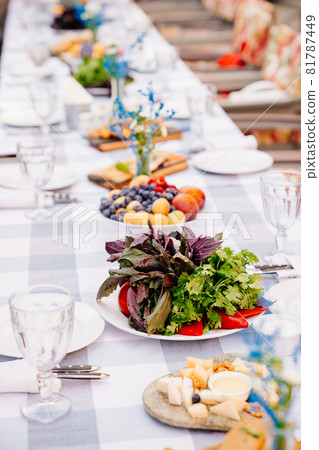 served festive table with snacks. holiday in open air. salad, fruits and cheeses served festive table with snacks. holiday in open air. salad, fruits and cheeses 81787449