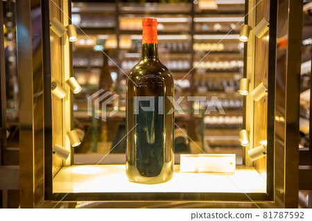 large wine bottle in a shining display case large wine bottle in a shining display case 81787592