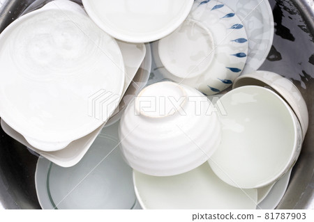 Washing dishes, Close up of utensils soaking in kitchen sink. Washing dishes, Close up of utensils soaking in kitchen sink. 81787903