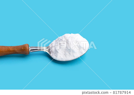 Baking soda on blue background. Baking soda on blue background. 81787914