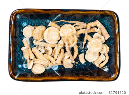 top view of sliced dried parsley roots in ceramic bowl cutout on white background top view of sliced dried parsley roots in ceramic bowl cutout on white background 81791320